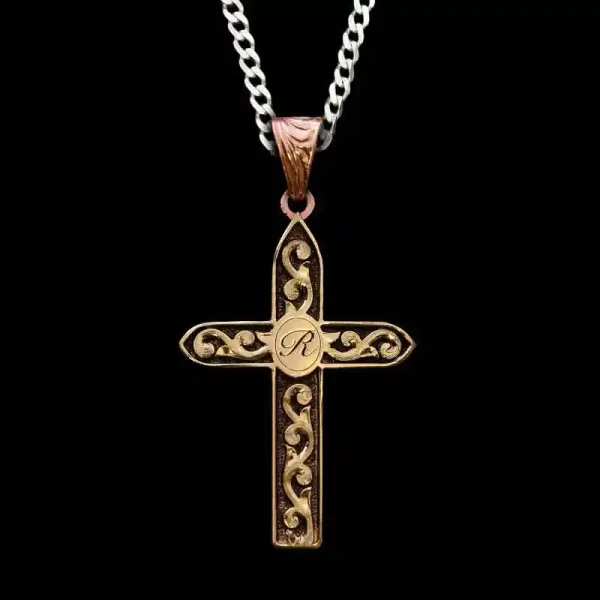 Personalize the Hosea Cross Pendant Necklace featuring a golden bronze base, scrolls and initials figure in the center. Pair it with a special discount sterling silver chain today!